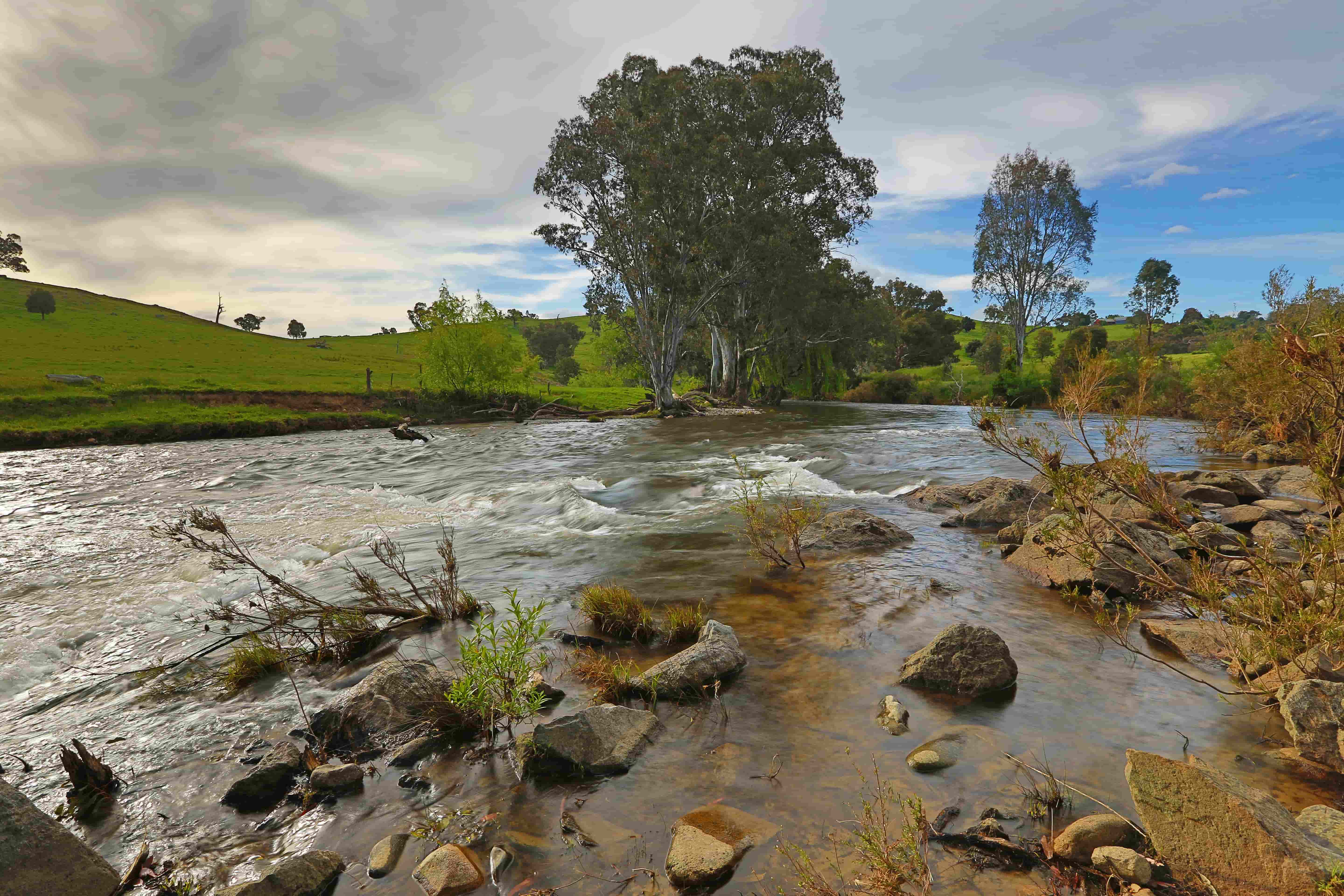 The Goobaragandra River bending through the property under a dramatic sky