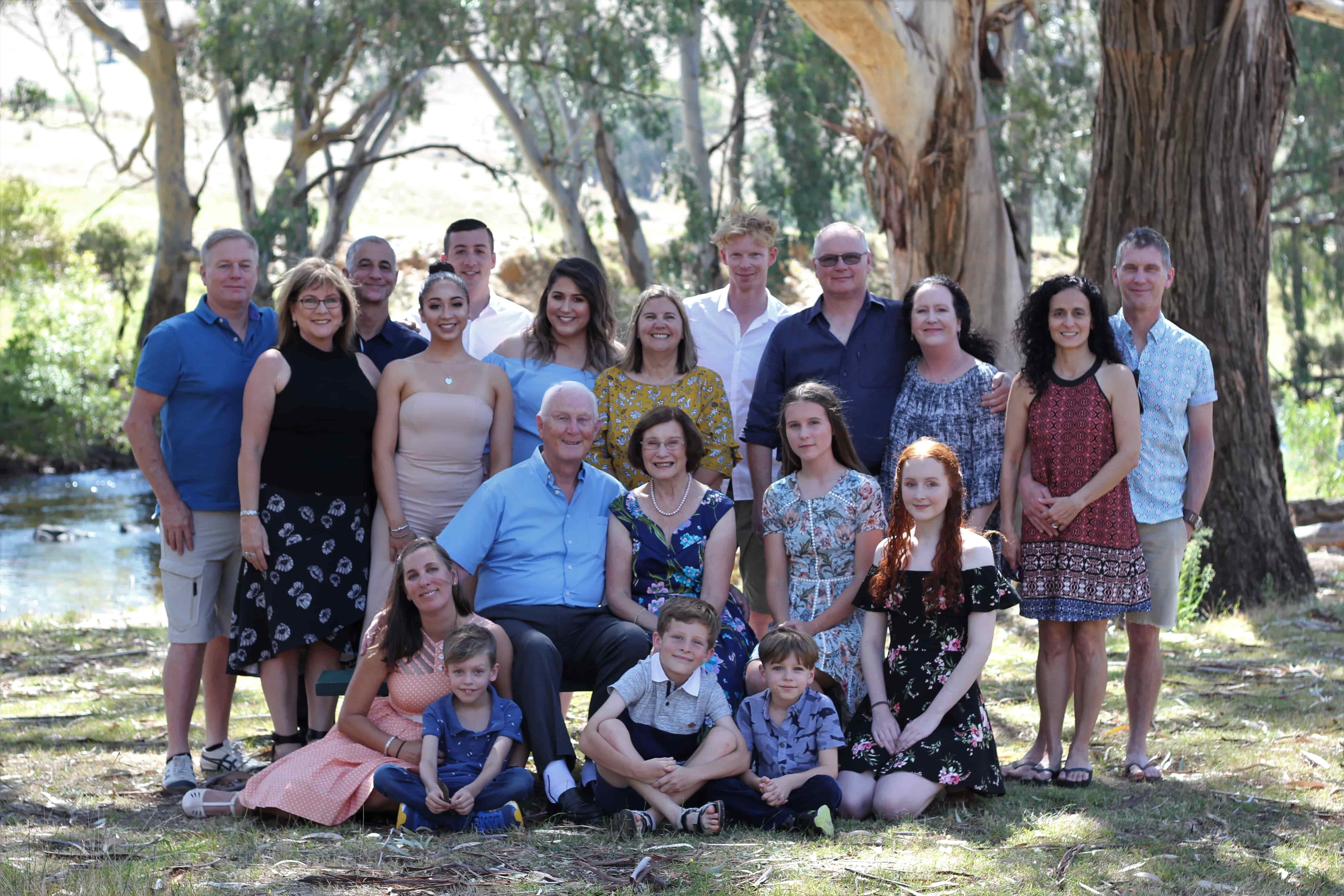 Extended family group portrait by the river at Elm Cottage