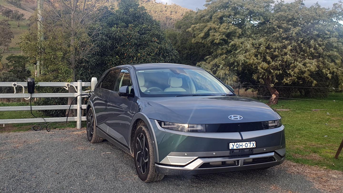 An electric car parked at the free EV charging point at Elm Cottage